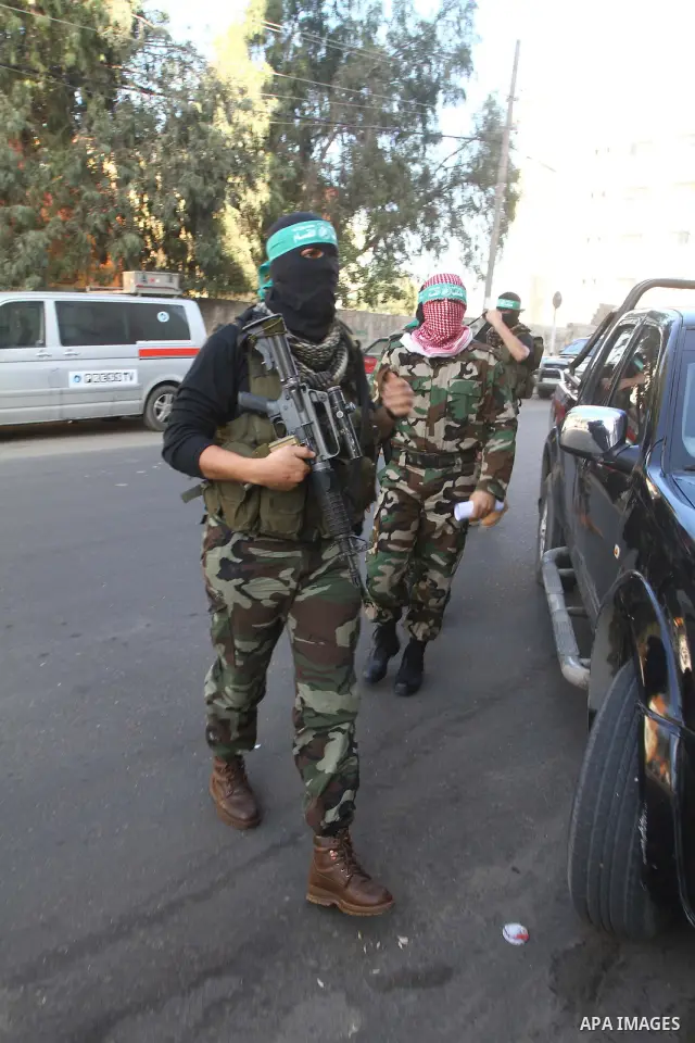 Members of Al-Qassam brigades, the armed wing of the Hamas movement, arrive for a news conference in Gaza City December 25, 2010. The militants showed statistics of their military activities against Israel. Photo by Ashr...