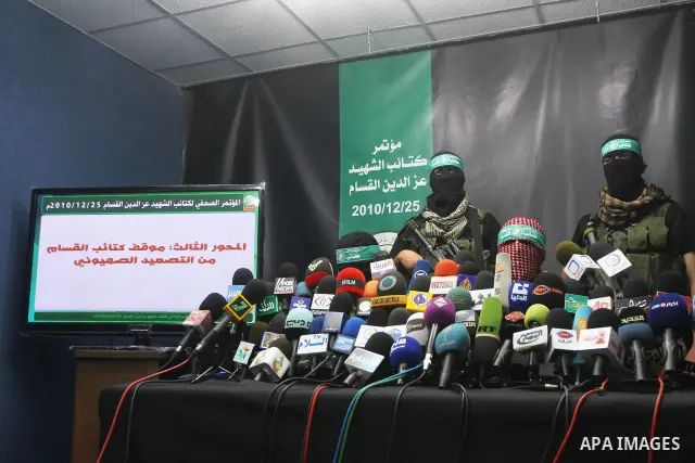 Masked Palestinian militants from Hamas attend a press conference in Gaza City , Saturday, Dec. 25, 2010. The militants showed statistics of their military activities against Israel. Photo by Ashraf Amra