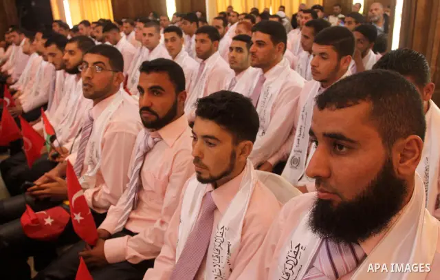 One hundred Palestinian brides and their grooms attend a celebration organized by by the Islamic Jihad Movement in Gaza City on Dec. 25,2010. Photo by Mohammed Asad