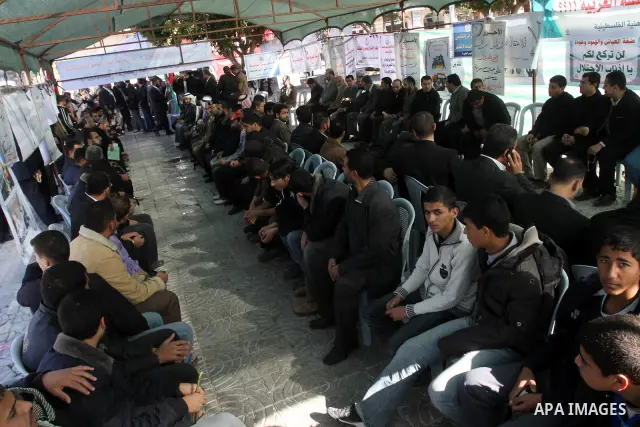 Palestinians attend a protest calling for the release of Hamas prisoners from jails in the West Bank controlled by Palestinian President Mahmoud Abbas' security forces, Gaza City on December 27,2010. Photo by Mohammed As...