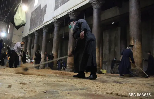Orthodox priests clean the Church of the Nativity in the biblical West Bank city of Bethlehem on December 30, 2010 as part of the preparations for the Orthodox faith's Christmas celebrations. The Orthodox faith in the ho...