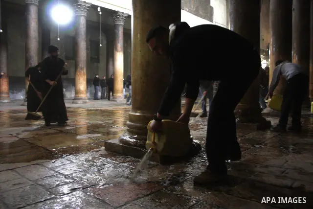 Orthodox priests clean the Church of the Nativity in the biblical West Bank city of Bethlehem on December 30, 2010 as part of the preparations for the Orthodox faith's Christmas celebrations. The Orthodox faith in the ho...