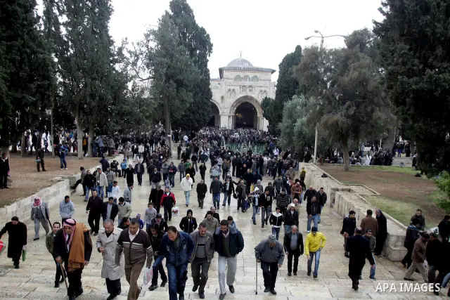 Palestinian Muslims walk in the Al Aqsa Mosque compound, also known to Jews as the Temple Mount, in Jerusalem's old city on Dec. 31, 2010. Photo by Mahfouz Abu Turk
