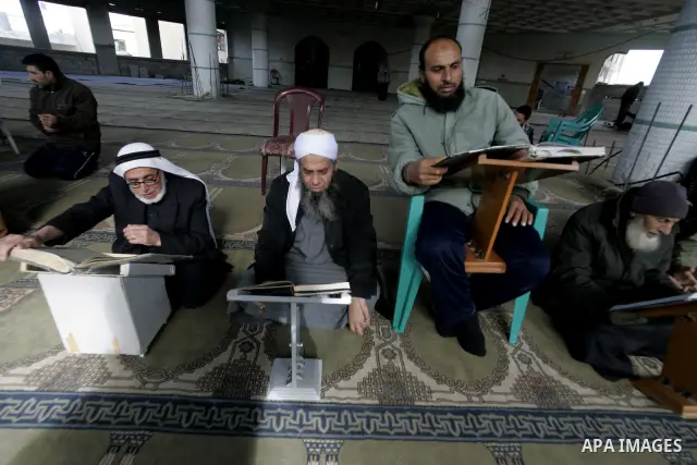Palestinian muslims attend Friday prayers in Al-Abrar mosque which was destroyed during the Israeli war on Gaza 2008-2009 in Rafah, southern Gaza Strip on December 31, 2010. Photo by Abed Rahim Khatib