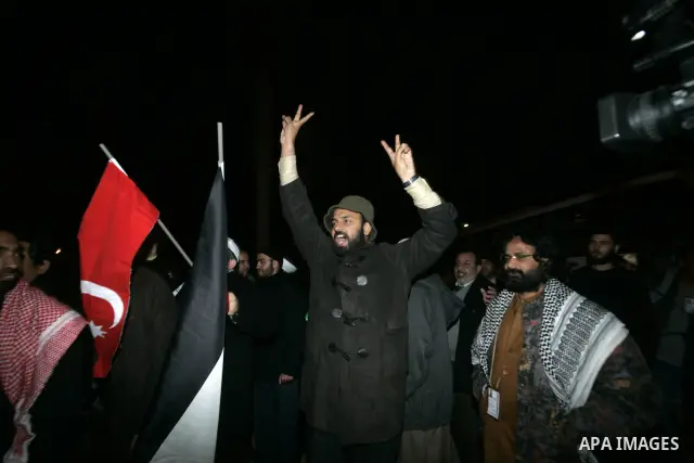 Pro-Palestinian activists shout upon their arrival to the Gaza Strip through Rafah border crossing between Egypt and southern Gaza Strip, Jan. 3, 2011. The Asia 1 convoy, gathering 170 activists from over 15 Asian states...