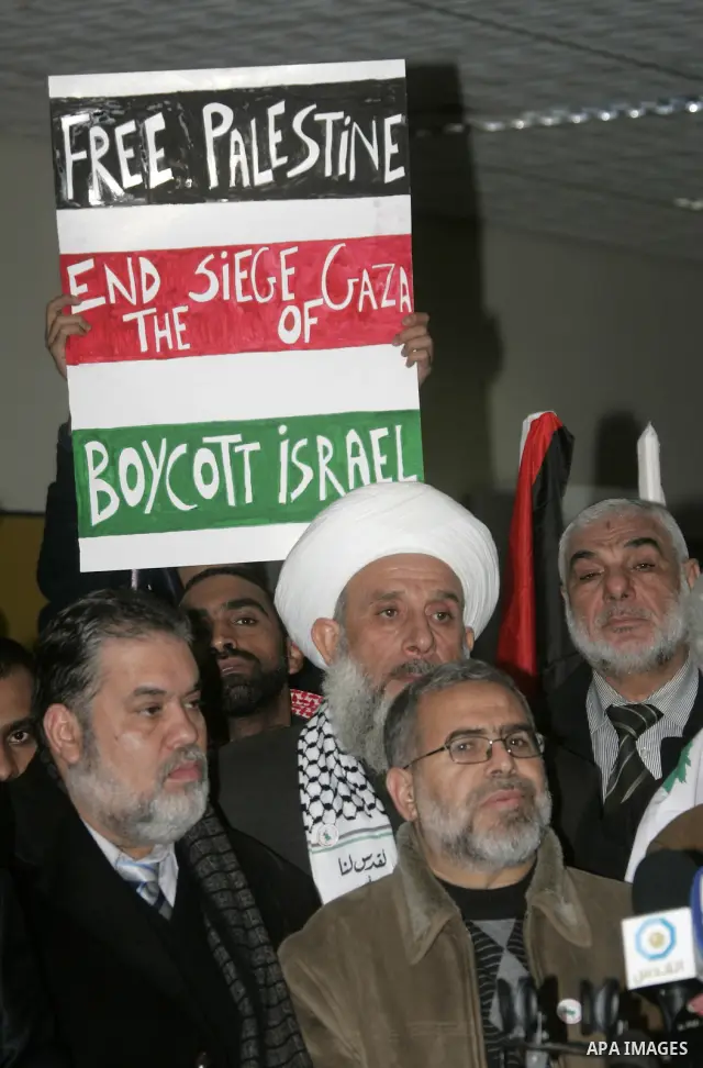 Pro-Palestinian activists from Asia 1 convoy attend a press conference upon their arrival to the Gaza Strip through Rafah border crossing between Egypt and southern Gaza Strip, Jan. 3, 2011. The Asia 1 convoy, gathering...