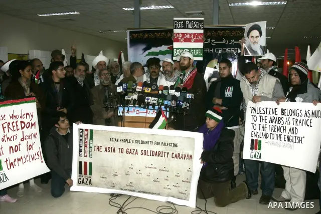 Pro-Palestinian activists from Asia 1 convoy attend a press conference upon their arrival to the Gaza Strip through Rafah border crossing between Egypt and southern Gaza Strip, Jan. 3, 2011. The Asia 1 convoy, gathering...