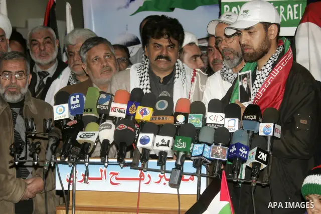 Pro-Palestinian activists from Asia 1 convoy attend a press conference upon their arrival to the Gaza Strip through Rafah border crossing between Egypt and southern Gaza Strip, Jan. 3, 2011. The Asia 1 convoy, gathering...