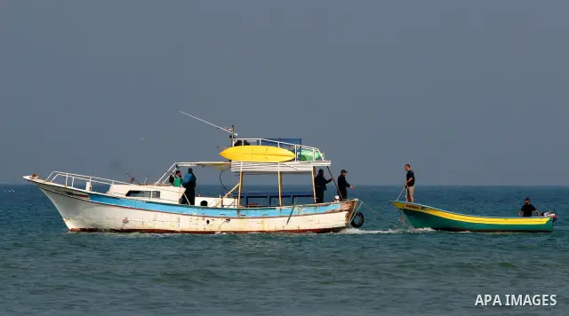 Members of Palestinian naval policemen preparing themselves to extract an ancient columns older than 1300 years belonging to palace from the Roman era in the port of Gaza City on Dec. 3,2010. Photo by Mohammed Asad