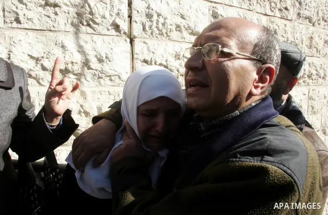 A Palestinian woman from the Siam family cries near the rubble of her house in the Sheikh Jarrah neighbourhood of East Jerusalem January 3, 2011 after it was destroyed earlier in the day by Israeli municipality bulldozer...