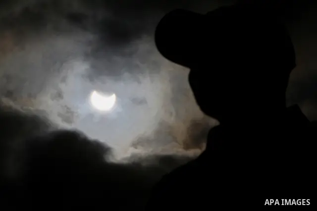 Picture shows the silhouette of a Palestinian man against the sky during a partial solar eclipse, in Gaza City on Tuesday 04 January 2011. The partial eclipse was visible near sunrise over most of Europe and northeastern...