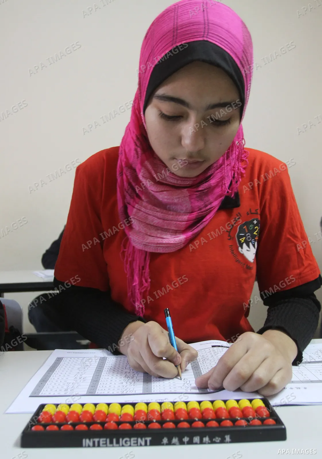 A Palestinian schoolgirl, Meyer-Tai, 14 years old attends a lesson at Intelligent Mental-Arithmetic school, in Gaza City on Jan. 3,2010. Meyer-Tai, has won the fourth place in the world competition Intelligent Mental-Ari...