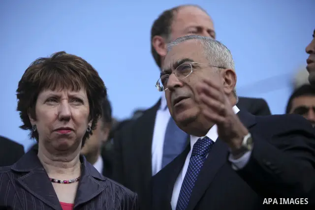 Palestinian Prime Minister, Salam Fayyad shows EU Foreign Policy Chief Catherine Ashton an area disputed with Israel on the outskirts of the West Bank city of Ramallah on January 6, 2011. Photo by Issam Rimawi