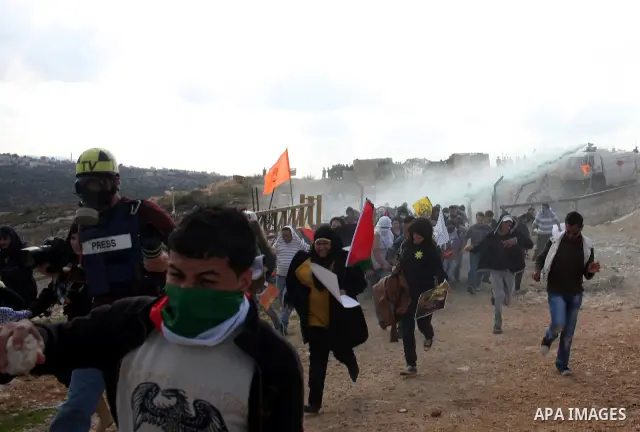 Isareli soldiers disperse protesters in the village of Bilin on January 7, 2011. Israeli troops in Hebron shot dead an elderly Palestinian civilian on Friday in a case of mistaken identity as they searched for a Hamas pr...