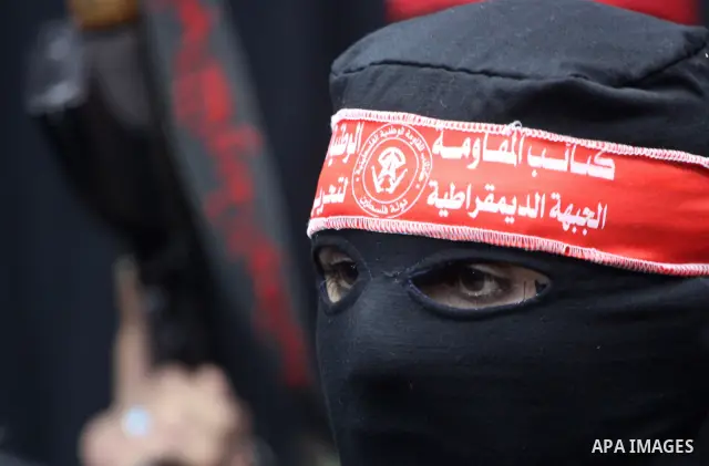 Palestinian fighters from National Resistance Brigades attend a press conference about the clashes with Israeli soldiers which killed an Israeli soldier and wounded 4 others east of the Bureij camp, Gaza City on Jan. 8,...