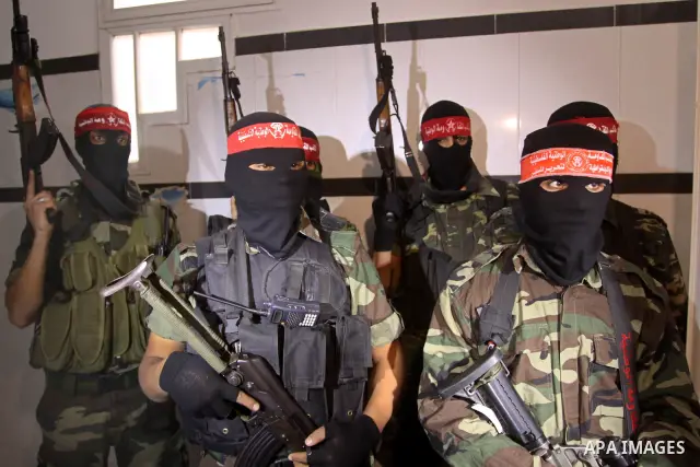 Palestinian fighters from National Resistance Brigades attend a press conference about the clashes with Israeli soldiers which killed an Israeli soldier and wounded 4 others east of the Bureij camp, Gaza City on Jan. 8,...