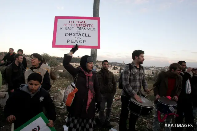 Demonstrators protest across the street from what remains of the Shepherd Hotel in the Sheikh Jarrah neighborhood in East Jerusalem during a protest against Jewish settlement of Arab East Jerusalem following the building...