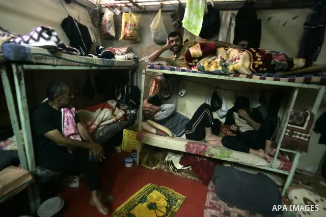 Palestinian inmates sit inside a cell at a prison controlled by the Hamas police in the southern Gaza Strip town of Khan Younis on Jan. 9, 2011. According to Hamas police, number of prisoners accused of spying for the Is...