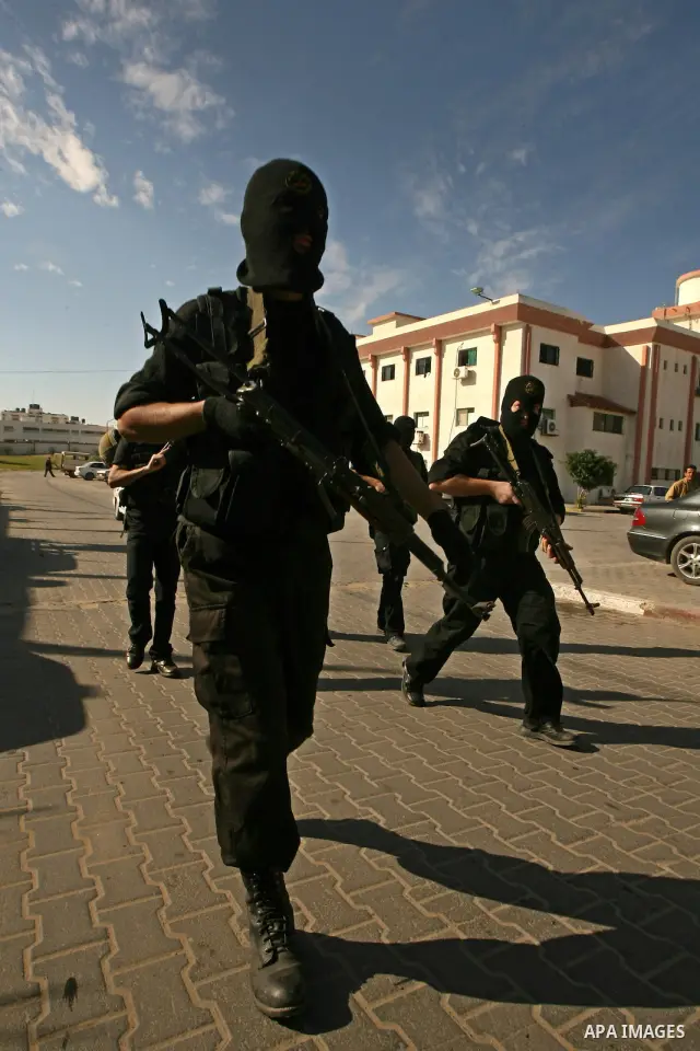 Palestinian militants from the Islamic Jihad attend the funeral of Mohamed al-Najjar, who was killed during an Israeli air strike the previous day, in Khan Yunis, southern Gaza Strip, on January 12, 2011. Photo by Abed R...