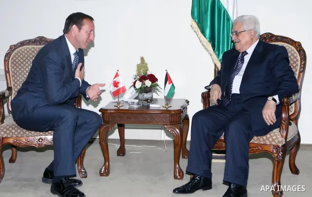 Palestinian President Mahmoud Abbas (R) during a meeting with the Canada's Defense Minister Peter MacKay , in the West Bank city of Ramallah on January 12, 2011. Photo by Thaer Ganaim