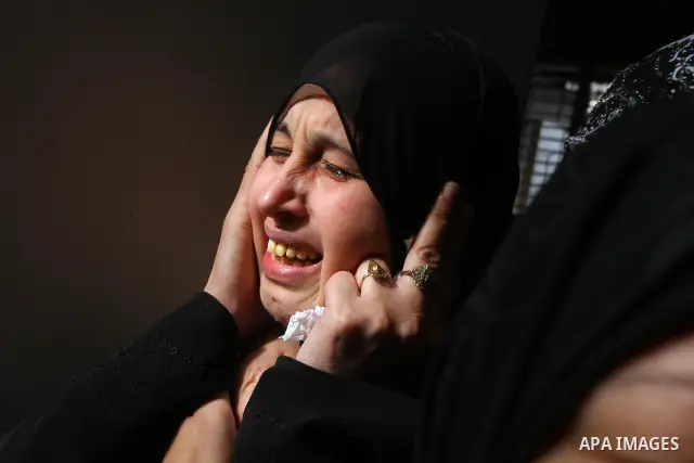 Palestinian relatives of Islamic Jihad militant Mohammed Najjar mourn during his funeral in Khan Younis in the southern Gaza Strip January 12, 2011. A missile fired by an Israeli aircraft killed the Palestinian militant...