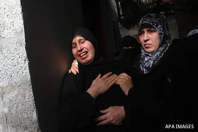 Palestinian relatives of Islamic Jihad militant Mohammed Najjar mourn during his funeral in Khan Younis in the southern Gaza Strip January 12, 2011. A missile fired by an Israeli aircraft killed the Palestinian militant...