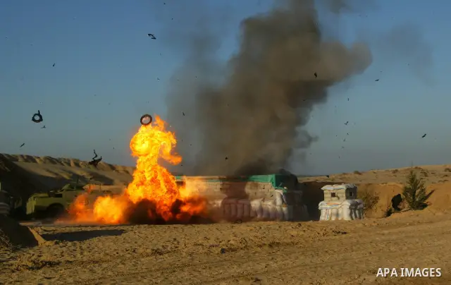 Palestinian fighters from the al-Ahrar Brigades (Freemen Brigade), an Islamist coalition of militants based in the Gaza Strip, show their skills during a training session in Khan Yunis in southern Gaza on January 13, 201...