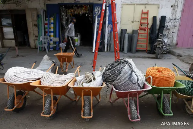 Palestinians sell construction materials that were smuggled through tunnels underground the border crossing between Egypt and Gaza in Rafah, southern Gaza Strip on January 16, 2011. Israel also imposed a tight blockade s...