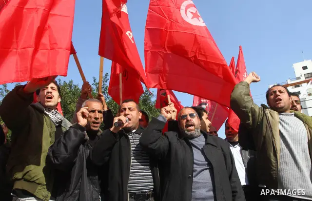 Palestinians chant slogans during a protest organized by Palestinian leftist groups in solidarity with Tunisia's national uprising, in Gaza City, Tuesday, Jan. 18, 2011. Photo by Ashraf Amra