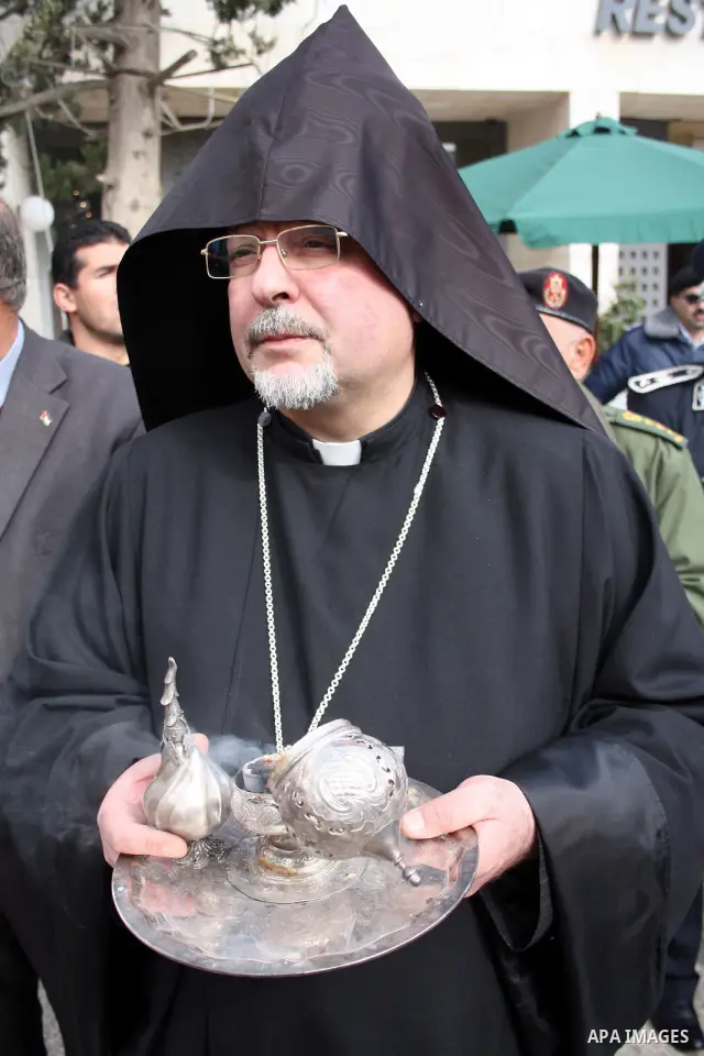 Orthodox Armenian take part in a procession outside the Church of the Nativity in the West Bank town of Bethlehem on Christmas Eve, January 18, 2011. While most Armenians celebrate Christmas on January 6th, the Orthodox...