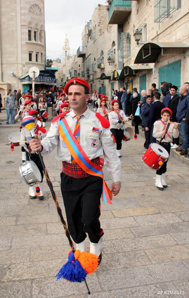 Orthodox Armenian take part in a procession outside the Church of the Nativity in the West Bank town of Bethlehem on Christmas Eve, January 18, 2011. While most Armenians celebrate Christmas on January 6th, the Orthodox...