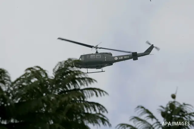 A military helicopter is seen in the streets of Tunis, Tunisia, 18 January 2011. Tunisian protesters called for the abolition of ousted president Zine El Abidine Ben Ali's ruling party on January 17 amid a chaotic power...