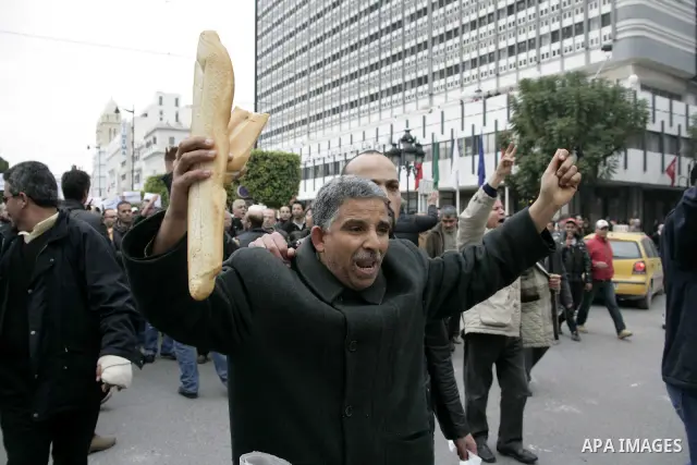 Protestors participate in a demonstration in downtown Tunis Jan. 18, 2011. Thousands of Tunisians flood the streets in downtown Tunis protesting against the interim government only one day after it was established. Photo...