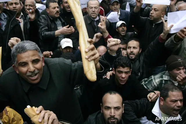 Protestors participate in a demonstration in downtown Tunis Jan. 18, 2011. Thousands of Tunisians flood the streets in downtown Tunis protesting against the interim government only one day after it was established. Photo...