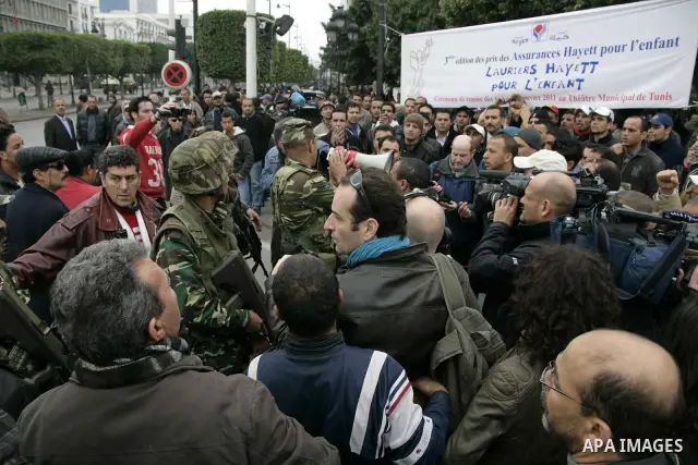 Protestors clash with police during a demonstration in downtown Tunis Jan. 18, 2011. Thousands of Tunisians flood the streets in downtown Tunis protesting against the interim government only one day after it was establis...