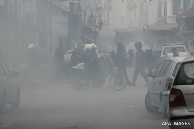 Tunisians run away as police use tear gas during a demonstration against Tunisia's ruling Constitutional Democratic Rally party (RCD) in the center of Tunis, Jan. 18. 2011. Tunisian interim president Foued Mebazaa and Pr...