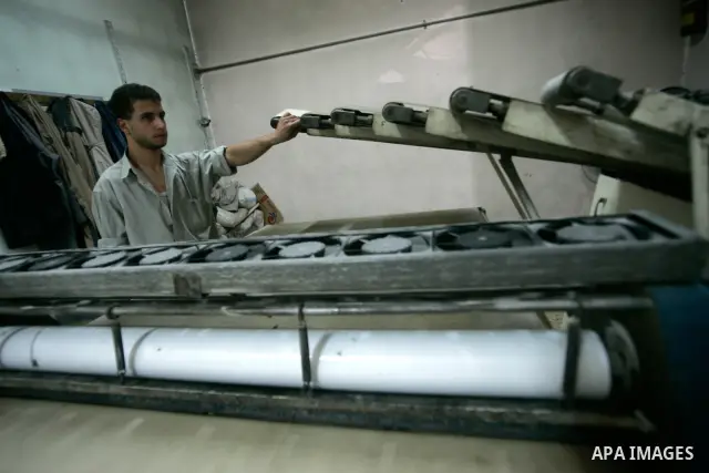 A Palestinian man stands at his stop bakery in the southern Gaza Strip town of Rafah on Jan. 20, 2011. The flour is running out and there will be a crisis within two days because of Israel's refusing to enter the flour t...