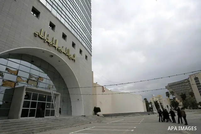 Tunisians take part in a protest in front of the headquarters of the Constitutional Democratic Rally (RCD) party of ousted president Zine al-Abidine Ben Ali during a demonstration in downtown Tunis, January 20, 2011. Tun...