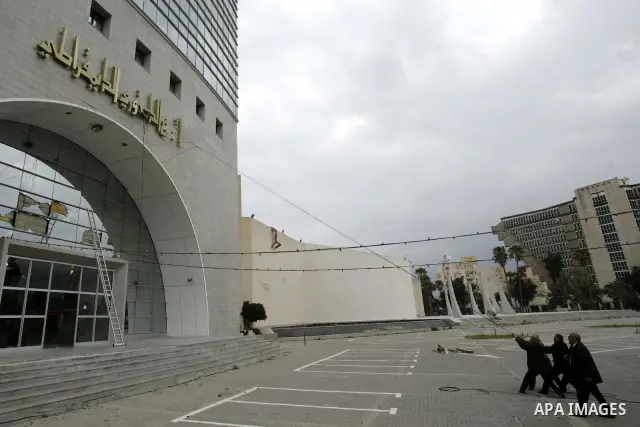 Tunisians take part in a protest in front of the headquarters of the Constitutional Democratic Rally (RCD) party of ousted president Zine al-Abidine Ben Ali during a demonstration in downtown Tunis, January 20, 2011. Tun...
