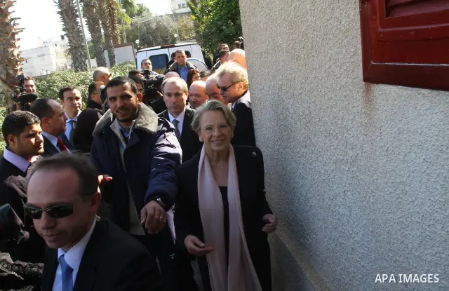 French Foreign Minister Michele Alliot-Marie walks at the French Institute in Gaza City, on Jan. 21, 2011. A crowd of furious Palestinian protesters tried to block the French foreign minister on her way into the Gaza Str...
