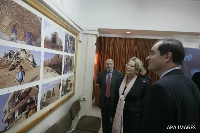 French Foreign Minister Michele Alliot Marie looks at pictures at the U.N. office in Gaza City, on Jan. 21, 2011. A crowd of furious Palestinian protesters tried to block the French foreign minister on her way into the G...