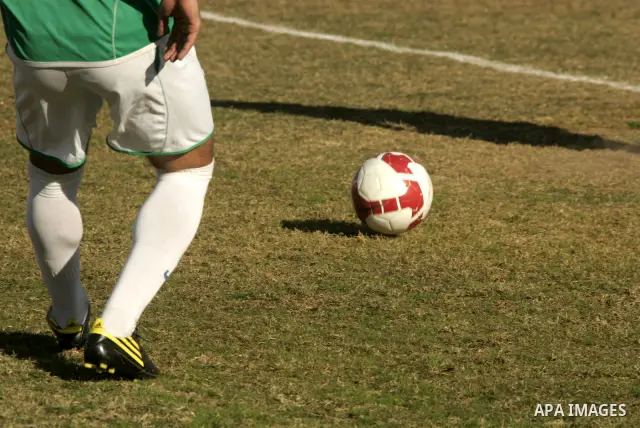 Players from Rafah Youth Club play against the players from Rafah Services Club during a football match in the league of the Gaza Strip at Rafah Municipality Stadium in the southern Gaza Strip on January 21, 2011. Photo...