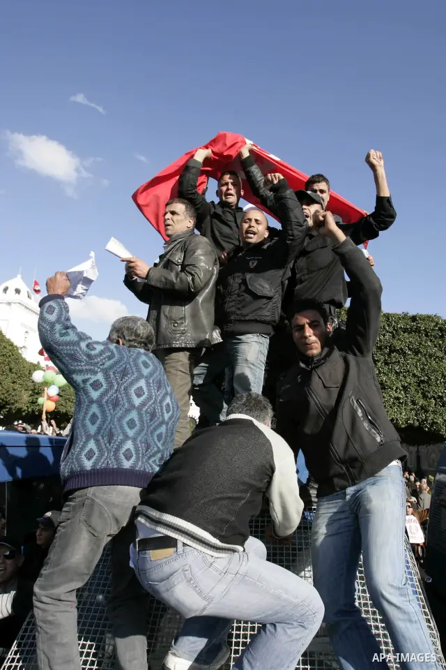 Protestors shout slogans in front of the Prime Minister's office in Tunis, Friday, Jan. 21 2011. Several hundred demonstrators also gathered peacefully across from the long-dreaded Interior Ministry in central Tunis, cha...