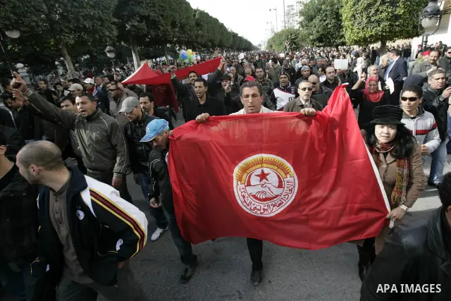 Protestors shout slogans in front of the Prime Minister's office in Tunis, Friday, Jan. 21 2011. Several hundred demonstrators also gathered peacefully across from the long-dreaded Interior Ministry in central Tunis, cha...