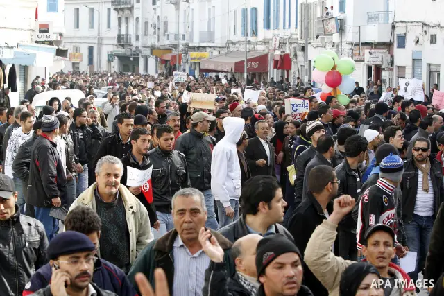 Protestors shout slogans in front of the Prime Minister's office in Tunis, Friday, Jan. 21 2011. Several hundred demonstrators also gathered peacefully across from the long-dreaded Interior Ministry in central Tunis, cha...