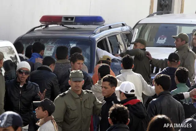 Tunisian protesters gather to demand a new government free of officials of the ousted regime of former president Zine el Abidine Ben Ali, near the Prime Minister's office in Tunis, Tunisia, 24 January 2011. According to...