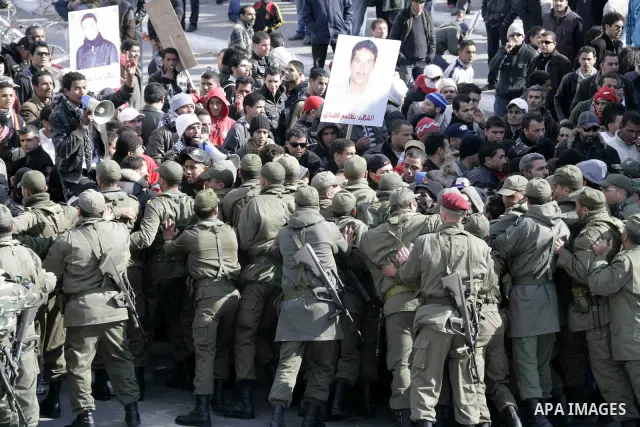 Tunisian protesters gather to demand a new government free of officials of the ousted regime of former president Zine el Abidine Ben Ali, near the Prime Minister's office in Tunis, Tunisia, 24 January 2011. According to...