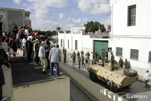 Tunisian protesters gather to demand a new government free of officials of the ousted regime of former president Zine el Abidine Ben Ali, near the Prime Minister's office in Tunis, Tunisia, 24 January 2011. According to...