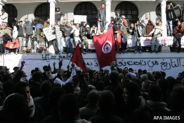 Tunisian protesters gather to demand a new government free of officials of the ousted regime of former president Zine el Abidine Ben Ali, near the Prime Minister's office in Tunis, Tunisia, 24 January 2011. According to...
