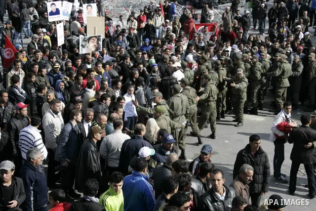 Tunisian protesters gather to demand a new government free of officials of the ousted regime of former president Zine el Abidine Ben Ali, near the Prime Minister's office in Tunis, Tunisia, 24 January 2011. According to...